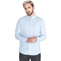 Calvin Klein Koszula Niebieski. Niebieskie koszule męskie Calvin Klein, l, bez wzorów, z elastanu, bez kołnierzyka, z długim rękawem. Za 395,95 zł.