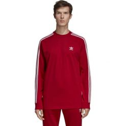MĘSKA KOSZULKA Z DŁUGIM RĘKAWEM ORIGINALS 3-STRIPES (M). Żółte koszulki męskie Adidas, m, w paski, z bawełny, bez kołnierzyka, z długim rękawem, długie. W wyprzedaży za 129,99 zł.