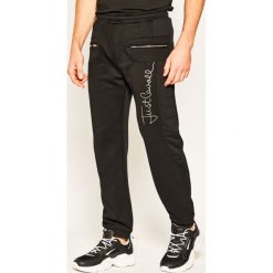 Spodnie dresowe Just Cavalli S03KA0226. Czarne jeansy męskie Just Cavalli, s, bez wzorów, z bawełny. W wyprzedaży za 759,00 zł.