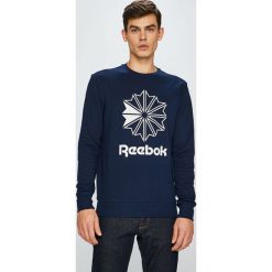 Reebok Classic - Bluza. Niebieskie bluzy męskie Reebok Classic, s, z nadrukiem, z elastanu, z okrągłym kołnierzem, bez rękawów, bez kaptura. W wyprzedaży za 179,90 zł.