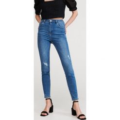 Jeansy slim z bawełny organicznej - Niebieski. Niebieskie jeansy damskie Reserved, bez wzorów, z bawełny. Za 79,99 zł.