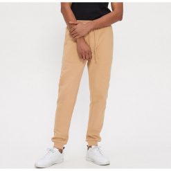 Joggery z organicznej bawełny - Beżowy. Brązowe spodnie męskie House, s, bez wzorów, z bawełny. Za 89,99 zł.