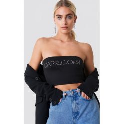 Galore x NA-KD Zdobiony top - Black. Czarne topy damskie marki Galore x NA-KD, z aplikacjami, bez kołnierzyka. W wyprzedaży za 50,47 zł.