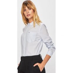 Tommy Jeans - Koszula. Białe bluzki damskie Tommy Jeans, s, bez wzorów, z bawełny, casualowe, bez kołnierzyka, z długim rękawem. W wyprzedaży za 239,90 zł.