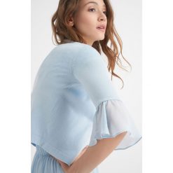 Krótki sweter z falbanką. Niebieskie bez kategorii Orsay, na lato, xs, z falbankami. Za 79,99 zł.