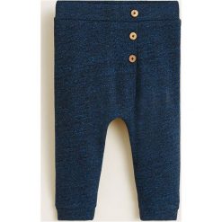 Mango Kids - Spodnie dziecięce 80-104 cm. Niebieskie spodnie chłopięce marki Mango Kids, bez wzorów, z bawełny, casualowe. Za 59,90 zł.