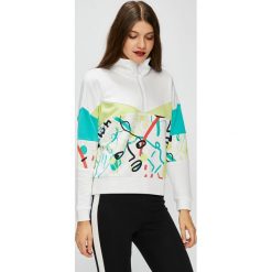 Puma - Bluza. Białe bluzy damskie marki Puma, s, bez wzorów, z elastanu, z krótkim rękawem, krótkie, bez kaptura. W wyprzedaży za 239,90 zł.