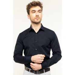 Koszula Boss Joram 50427552. Białe koszule męskie Boss, m, bez wzorów, z bawełny, biznesowe, bez kołnierzyka, bez rękawów. W wyprzedaży za 299,00 zł.