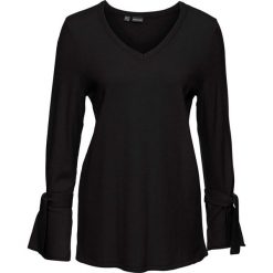 Sweter dzianinowy z rozkloszowanymi rękawami bonprix czarny. Czarne swetry damskie marki bonprix, bez wzorów, z dzianiny, bez rękawów, bez kaptura. Za 37,99 zł.