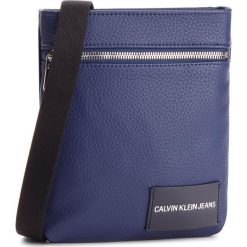 Saszetka CALVIN KLEIN JEANS - Pebble Essential Mic K40K400660 453. Niebieskie saszetki damskie Calvin Klein Jeans, bez wzorów, z jeansu, młodzieżowe, bez dodatków. W wyprzedaży za 249,00 zł.