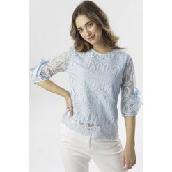 Jasnoniebieska Bluzka Pirenore. Niebieskie bluzki damskie Born2be, xl, bez wzorów, bez kołnierzyka, bez rękawów. W wyprzedaży za 69,99 zł.