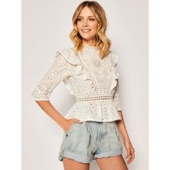 Bluzka The Kooples FTOP20040K. Białe bluzki damskie The Kooples, bez wzorów, z bawełny, bez kołnierzyka, bez rękawów. Za 899,00 zł.