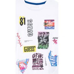 Guess Jeans - T-shirt dziecięcy 118-176 cm. Szare t-shirty męskie marki Guess Jeans, l, z nadrukiem, z bawełny, z okrągłym kołnierzem. W wyprzedaży za 89,90 zł.