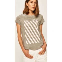 Guess Jeans - T-shirt. Niebieskie bluzki damskie Guess Jeans, s, z nadrukiem, z bawełny, z okrągłym kołnierzem. Za 169,90 zł.