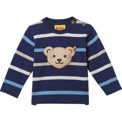 Bluza w kolorze niebiesko-białym. Szare bluzy niemowlęce Steiff, w paski, bez rękawów, bez kaptura. W wyprzedaży za 58,95 zł.