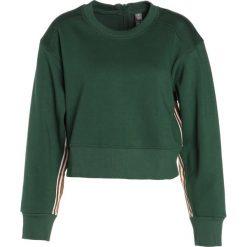 Bluzy rozpinane damskie: adidas by Stella McCartney TRAIN Bluza dark green