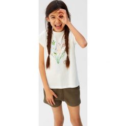 Mango Kids - T-shirt dziecięcy Amore 110-164 cm. Białe bluzki dziewczęce Mango Kids, z nadrukiem, z bawełny, z okrągłym kołnierzem, bez rękawów, bez kaptura. Za 59,90 zł.