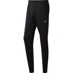Spodnie do biegania męskie REEBOK WORKOUT READY TRACKSTER PANT BLACK / CW5031. Czarne spodnie męskie Reebok, m, bez wzorów. Za 114,99 zł.