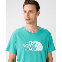 The North Face Easy Koszulka Niebieski. Niebieskie podkoszulki męskie The North Face, s, z nadrukiem, z bawełny, bez kołnierzyka, z krótkim rękawem, krótkie. Za 135,95 zł.
