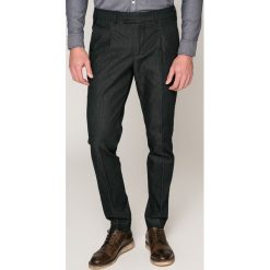 Marciano Guess - Spodnie. Niebieskie bez kategorii MARCIANO GUESS, z haftami, z elastanu. W wyprzedaży za 199,90 zł.
