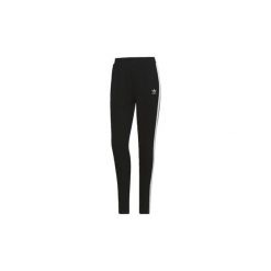 Legginsy i Rajstopy adidas Spodnie. Czarne rajstopy damskie Adidas, bez wzorów. Za 174,30 zł.