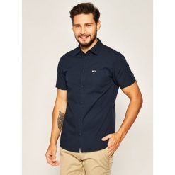 Koszula Tommy Jeans Shortsleeve Poplin DM0DM07923. Niebieskie koszule męskie Tommy Jeans, xxl, bez wzorów, z bawełny, casualowe, bez kołnierzyka, bez rękawów. Za 279,00 zł.
