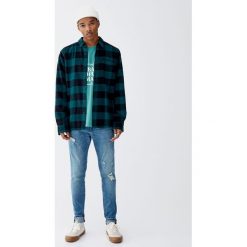 Jeansy skinny fit z przetarciami. Niebieskie jeansy męskie marki Pull&Bear, m, bez wzorów. Za 139,00 zł.