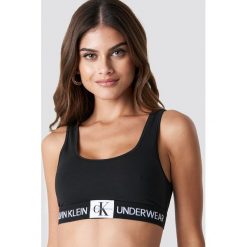Calvin Klein Biustonosz Unlined Monogram Bralette - Black. Czarne biustonosze z fiszbinami marki Calvin Klein. Za 141,95 zł.