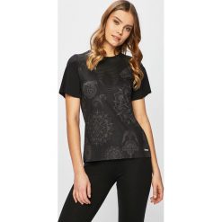 Desigual Sport - Top sportowy. Czarne topy damskie marki Desigual Sport, s, bez wzorów, z elastanu, z okrągłym kołnierzem. Za 179,90 zł.