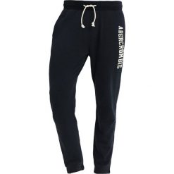 Abercrombie & Fitch CORE LOGO CLASSIC PANT Spodnie treningowe navy. Niebieskie spodnie męskie marki Abercrombie & Fitch, xl, bez wzorów, z bawełny. Za 349,00 zł.