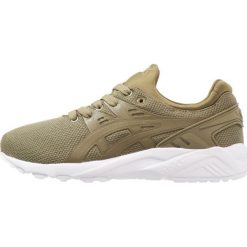 Asics Tiger GELKAYANO TRAINER EVO Tenisówki i Trampki martini olive. Zielone tenisówki damskie Asics Tiger, z tworzywa sztucznego. W wyprzedaży za 227,40 zł.