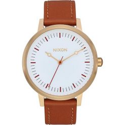 Zegarek kwarcowy "Kensington Leather" w kolorze brązowo-złotym. Pomarańczowe, analogowe zegarki damskie Nixon, złote. W wyprzedaży za 179,95 zł.