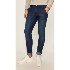 Guess Jeans - Jeansy Adam. Niebieskie jeansy męskie Guess Jeans, m, z aplikacjami. Za 469,90 zł.
