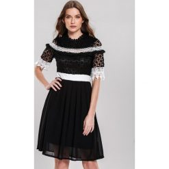 Czarna Sukienka Delegitimize. Czarne sukienki damskie other, s, bez wzorów, bez kołnierzyka, bez rękawów, mini. Za 129,99 zł.
