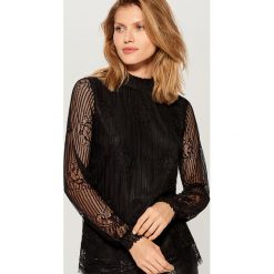 Bluzka z transparentnymi rękawami - Czarny. Czarne bluzki damskie marki Mohito, s, bez wzorów, bez kołnierzyka, bez rękawów. Za 99,99 zł.