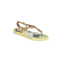Japonki Havaianas LUNA PRINT. Żółte klapki damskie Havaianas, bez wzorów, bez obcasa. Za 83,30 zł.