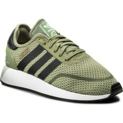 Buty adidas - N-5923 DB0959 Tengrn/Carbon/Ftwwht. Zielone buty sportowe damskie Adidas, bez wzorów, ze skóry ekologicznej, bez obcasa, na płaskiej podeszwie, na sznurówki. W wyprzedaży za 279,00 zł.
