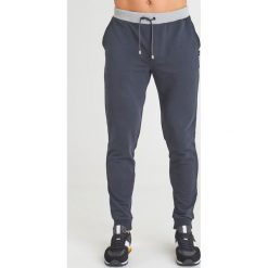 SPODNIE DRESOWE aeronautica militare. Niebieskie spodnie męskie Aeronautica Militare, m, bez wzorów, z dresówki. Za 499,00 zł.