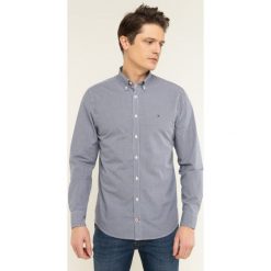 Koszula TOMMY HILFIGER MW0MW06777. Niebieskie koszule męskie TOMMY HILFIGER, m, bez wzorów, z bawełny, casualowe, bez kołnierzyka, bez rękawów. W wyprzedaży za 169,00 zł.
