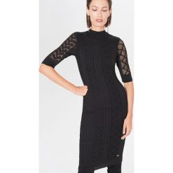 Sukienka bodycon z półgolfem - Czarny. Czarne sukienki damskie Mohito, s, bez wzorów, bez kołnierzyka, bez rękawów, bodycon. Za 139,99 zł.