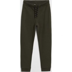 Mango Kids - Spodnie dziecięce Francia 110-164 cm. Żółte spodnie chłopięce Mango Kids, bez wzorów, z bawełny. Za 45,99 zł.