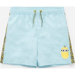 Szorty plażowe z Minionkami - Niebieski. Niebieskie spodenki i szorty męskie Reserved, bez wzorów. W wyprzedaży za 25,99 zł.
