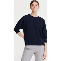 Bluzka z ekologicznego poliestru - Granatowy. Niebieskie bluzki damskie Reserved, s, bez wzorów, bez kołnierzyka, bez rękawów. Za 79,99 zł.