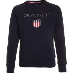 GANT SHIELD LOGO C NECK Bluza evening blue. Niebieskie bluzy dziewczęce marki GANT, z bawełny. Za 299,00 zł.