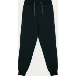 Name it - Spodnie dziecięce 116-152 cm. Niebieskie dresy chłopięce Name it, bez wzorów, z elastanu. Za 69,90 zł.