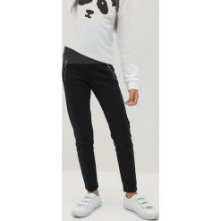 Mango Kids - Legginsy dziecięce Roma 110-164 cm. Niebieskie spodnie dziewczęce Mango Kids, bez wzorów, z elastanu. Za 59,99 zł.