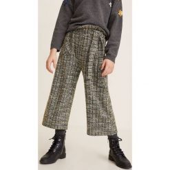 Mango Kids - Spodnie dziecięce Panel 110-164 cm. Czarne spodnie dziewczęce Mango Kids, bez wzorów, z bawełny, casualowe. W wyprzedaży za 59,90 zł.