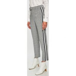 Tommy Hilfiger - Spodnie. Szare spodnie damskie TOMMY HILFIGER, z haftami, z elastanu. W wyprzedaży za 359,90 zł.