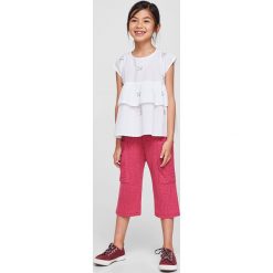 Mango Kids - Top dziecięcy Telat 110-164 cm. Szare bluzki dziewczęce marki Mango Kids, z aplikacjami, z bawełny, z okrągłym kołnierzem, z krótkim rękawem. W wyprzedaży za 49,90 zł.