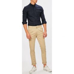 Calvin Klein Jeans - Spodnie. Brązowe chinosy męskie marki Calvin Klein Jeans, z haftami, z elastanu. W wyprzedaży za 269,90 zł.